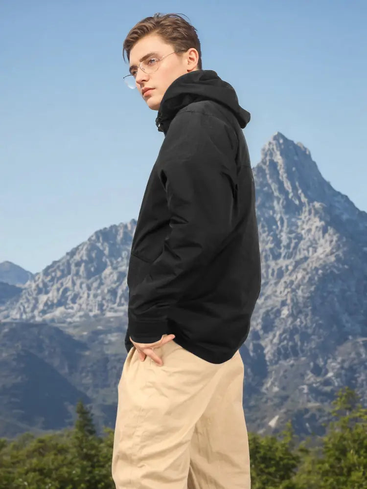 Men’s black hooded tactical assault rainproof parka with sleek modern design and subtle stitching details