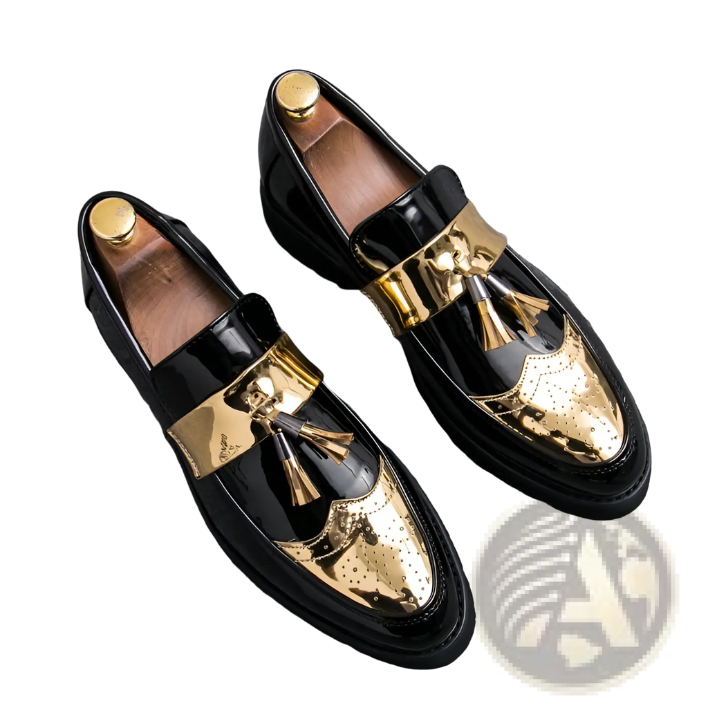 Men’s black and gold patent leather tassel loafers with metallic strap and glossy finish