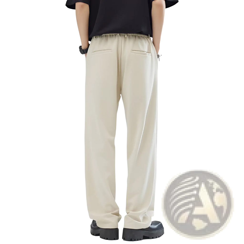 Beige men’s pleated wide leg relaxed fit trousers shown from the back with elastic waistband and two back pockets