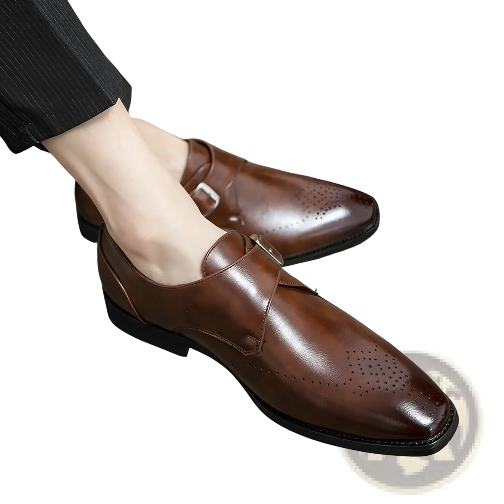Men’s polished brown leather monk strap dress shoes with decorative perforated detailing and a sleek finish