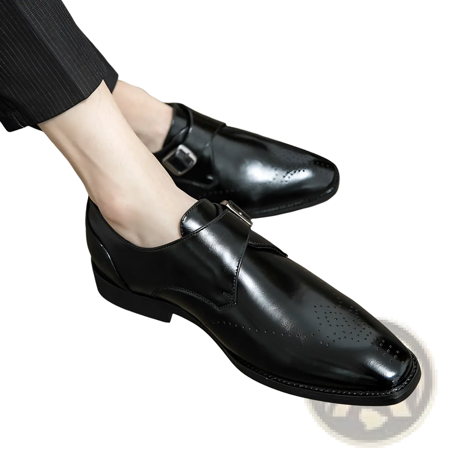 Men’s polished black leather monk strap dress shoes with a sleek finish and subtle perforated detailing on the toe