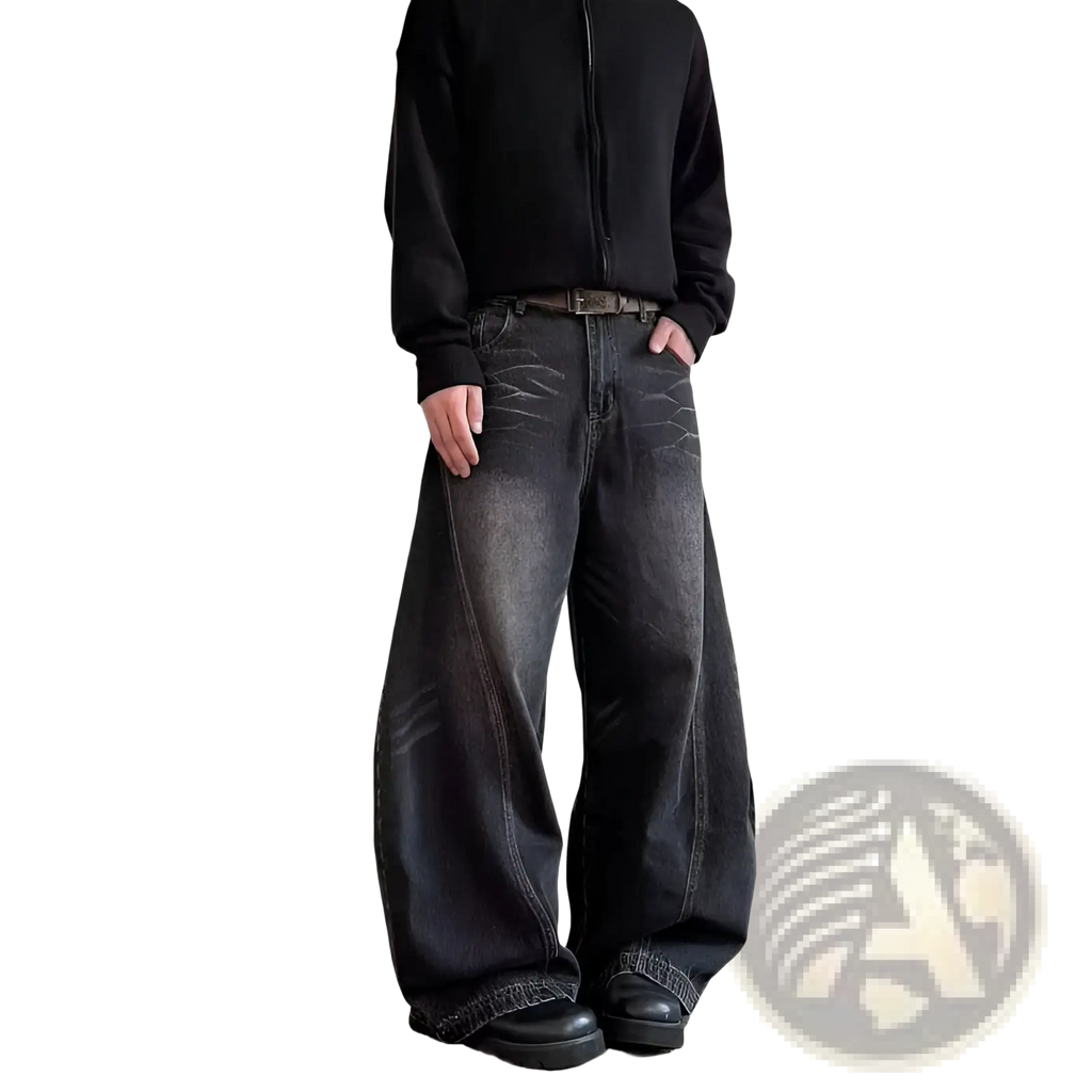 Men’s premium relaxed wide leg denim jeans in black with faded distressed texture and subtle whiskering details