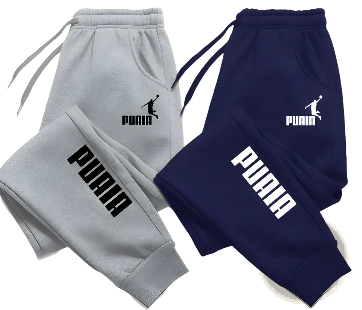 Mens print joggers casual streetwear sweatpants in gray and navy blue with drawstrings and Puma logo on leg and waistband