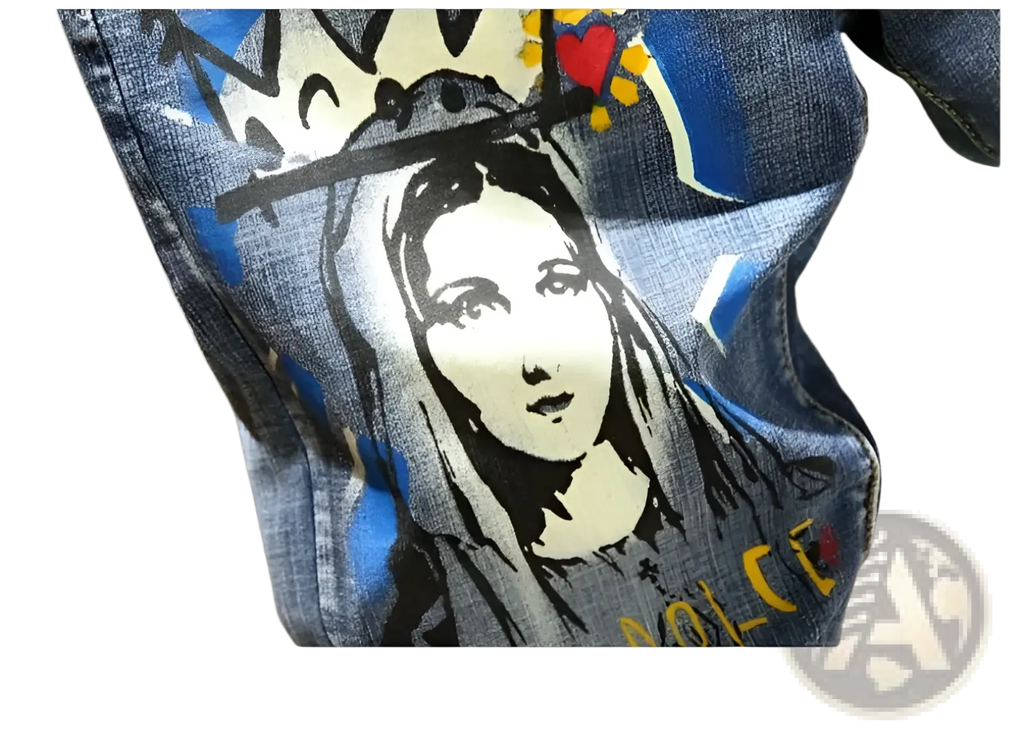 Men’s printed stretch slim jeans in blue denim featuring a bold black and white graphic of a crowned figure with red and yellow accents