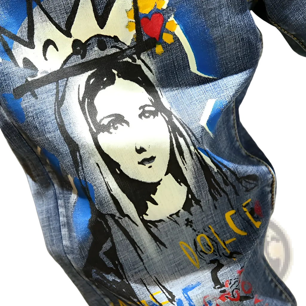 Men’s printed stretch slim blue denim jeans featuring a bold stylized graphic of the Virgin Mary with a crown and heart motif