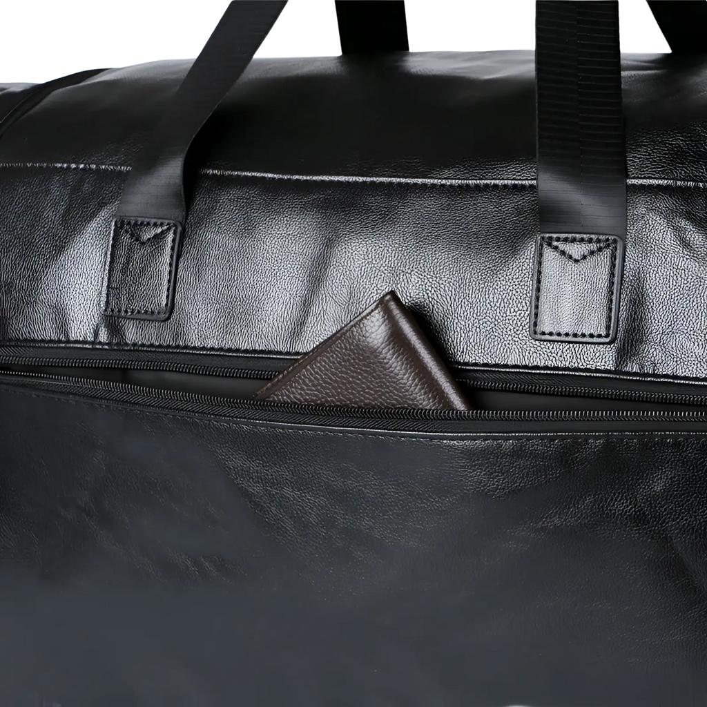 Black leather men’s pu leather travel duffel bag with sturdy handles and visible zipper pocket holding brown wallet