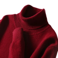 A rich burgundy men’s pure wool turtleneck sweater with soft knit texture and ribbed collar for winter wear