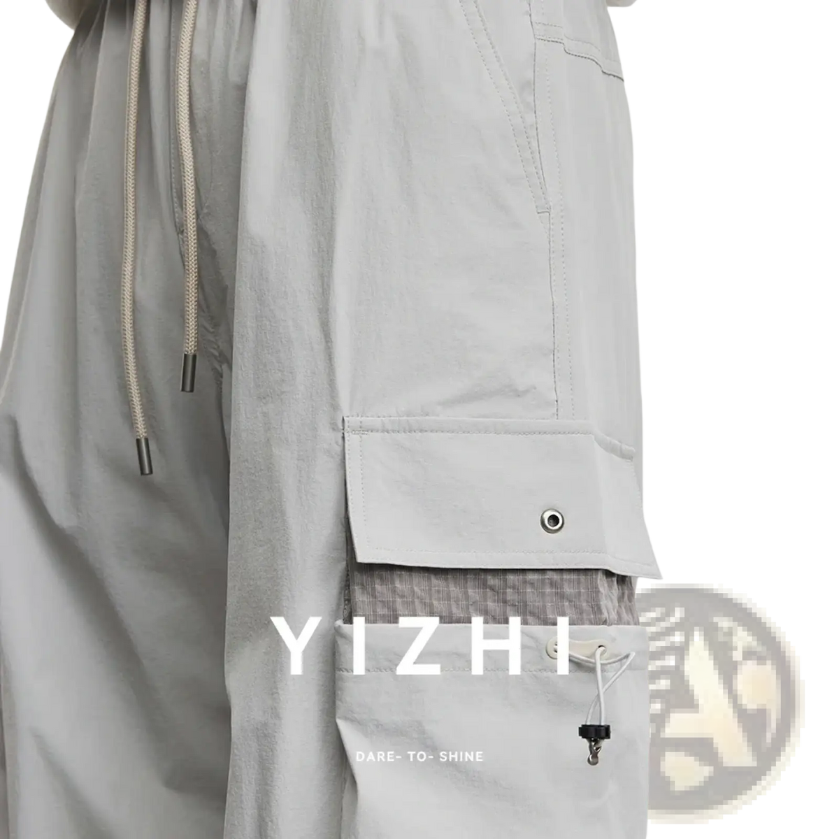 Men’s light gray quick dry cargo pants featuring a drawstring waist, multiple pockets, and subtle stitching details