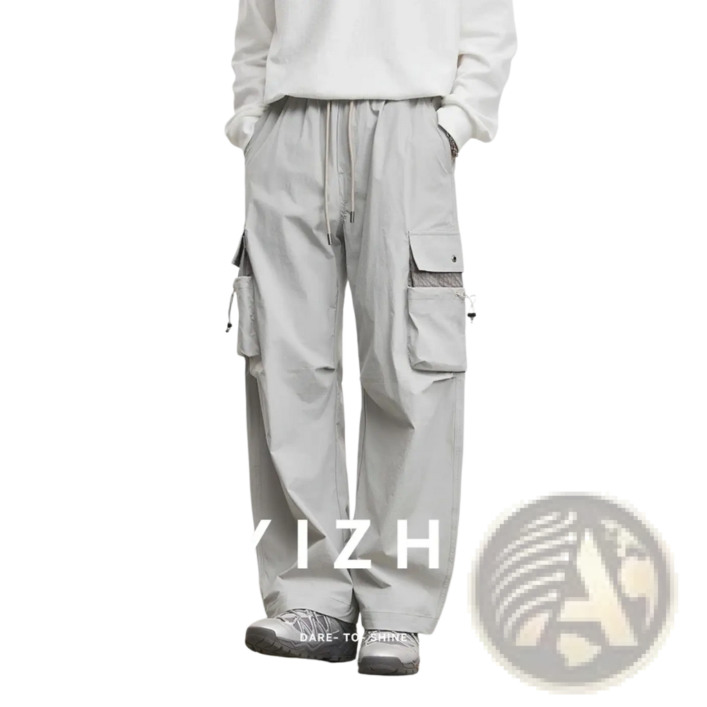 Men’s light gray quick dry cargo pants with multiple pockets and drawstring waistband for casual use