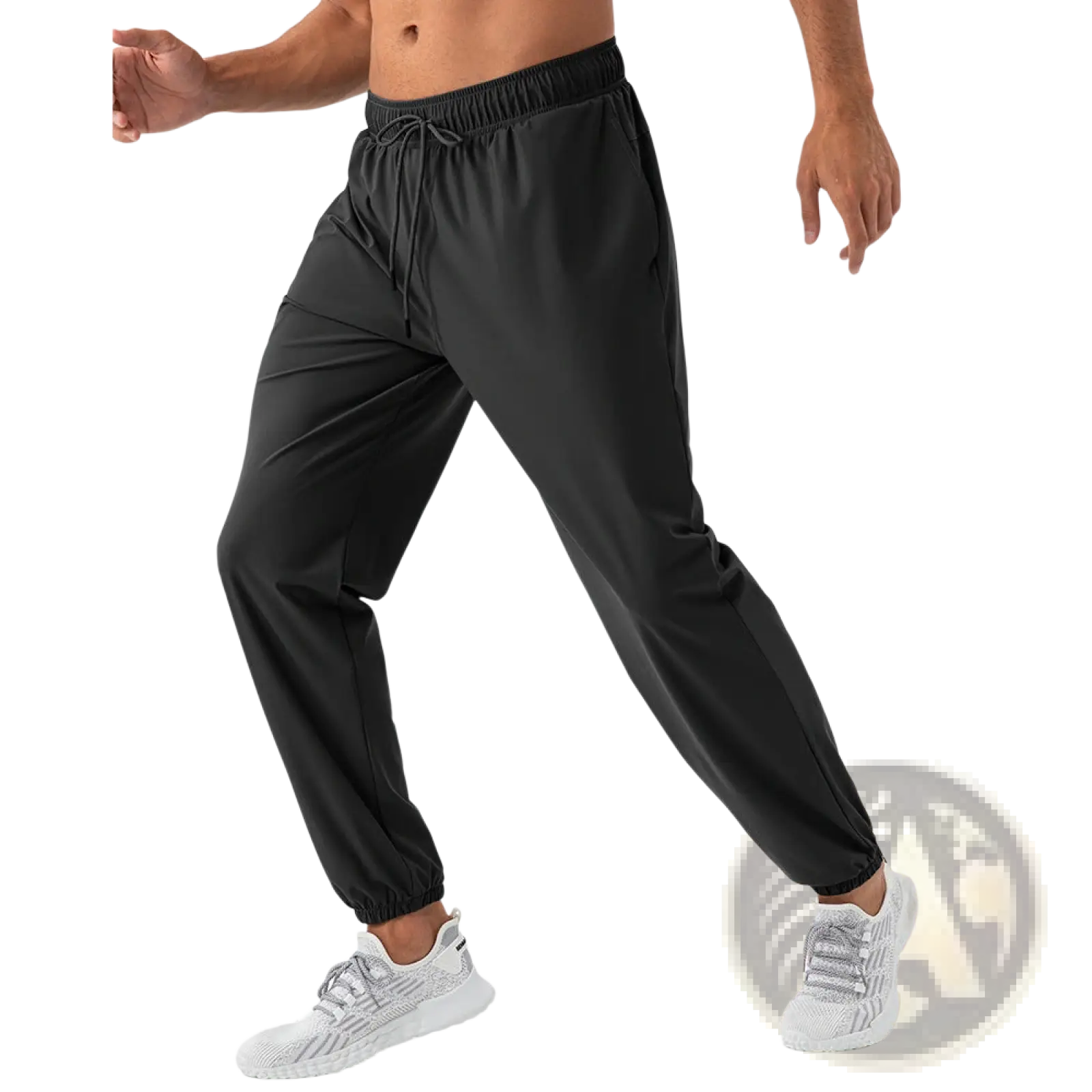 Men’s quick dry nylon loose fit athletic track pants in black with elastic waistband drawstring tapered legs and ribbed cuffs
