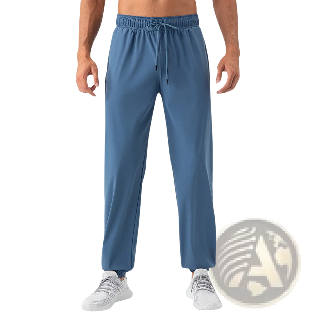 Men’s quick dry nylon loose fit athletic track pants in blue with elastic waistband and drawstring made from lightweight fabric