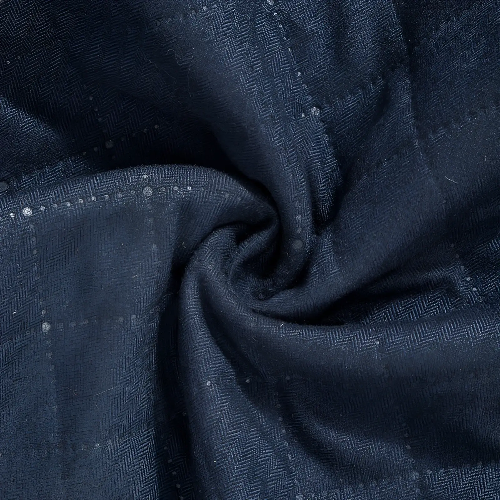 Dark blue herringbone quilted corduroy men’s casual jacket fabric with subtle textured weave and faint speckled accents