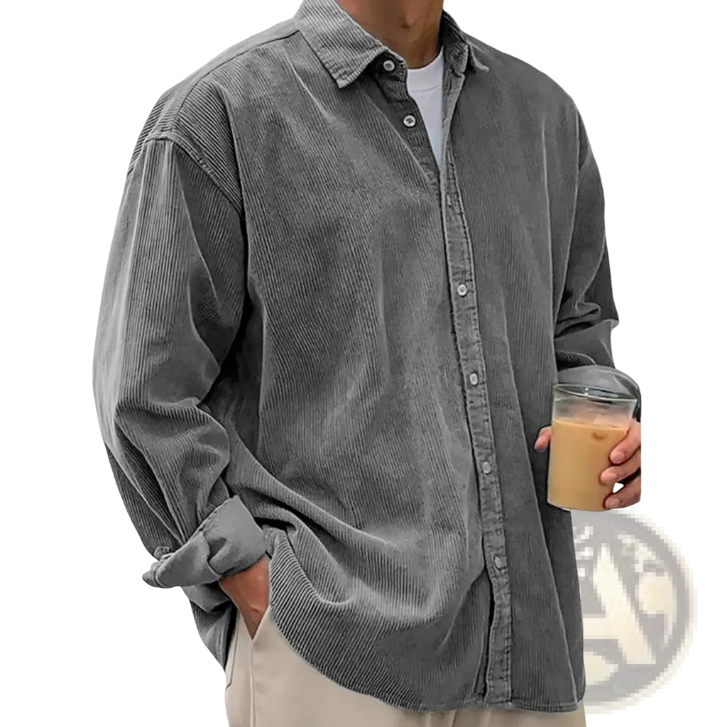 Men’s relaxed fit gray corduroy shirt jacket with classic collar and long sleeves worn casually over a white tee