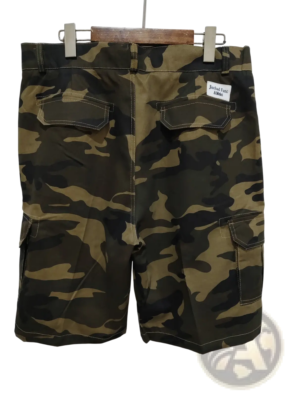 Men’s relaxed fit cotton camouflage cargo shorts in olive and dark green with multiple pockets and contrasting stitching