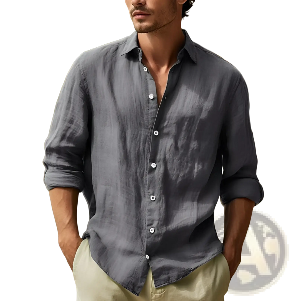 A man wearing a dark gray men’s relaxed fit cotton linen long sleeve shirt with rolled-up sleeves and white buttons
