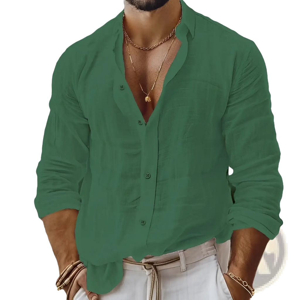 A man wearing a green relaxed fit cotton linen long sleeve shirt with rolled cuffs and subtle texture