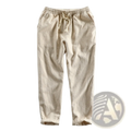 Beige linen men’s joggers with elastic waistband, drawstring, relaxed fit, and rolled cuffs for casual wear