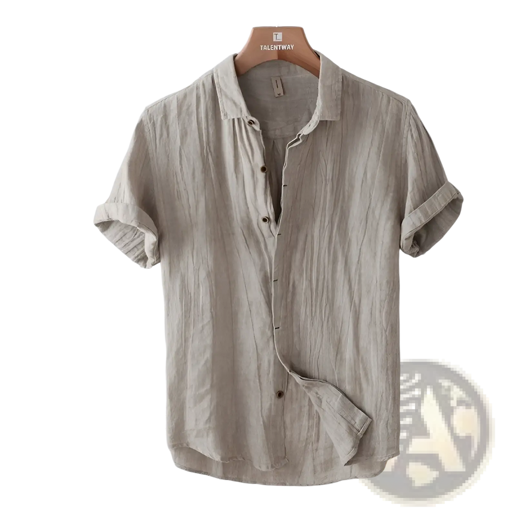 A beige men’s retro distressed short sleeve button-up shirt in textured linen fabric with rolled cuffs on a wooden hanger