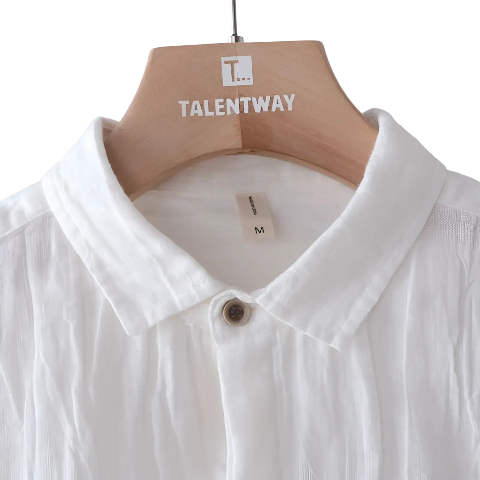 Men’s retro distressed crisp white linen short sleeve shirt with classic collar and single brown button on wooden hanger