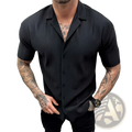 Men’s black ribbed knit short sleeve button up shirt featuring a vertical ribbed texture and short sleeves