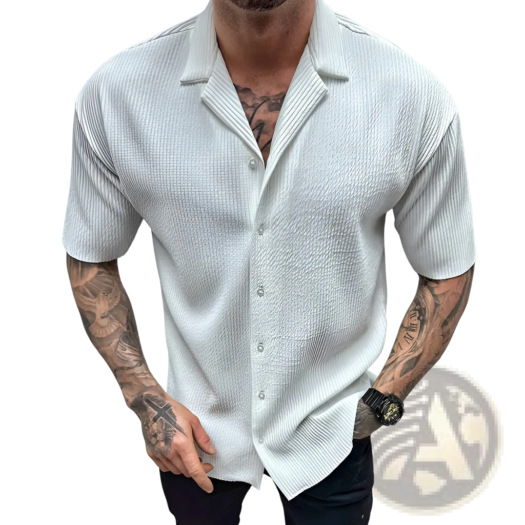 A crisp white men’s ribbed knit short sleeve button up shirt with textured fabric and a classic collar