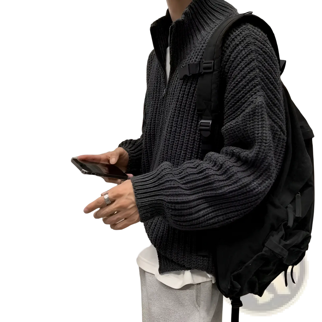 Dark gray ribbed knit zip up sweater cardigan for men featuring high collar and front zipper closure