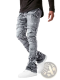 Men’s ripped stacked denim jeans in distressed gray with frayed and ripped sections for streetwear style