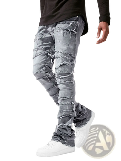 Men’s ripped stacked denim jeans in distressed gray with frayed and ripped sections for streetwear style