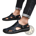 Men’s roman black leather sandals with stitched detailing and buckle strap featuring a rubber sole