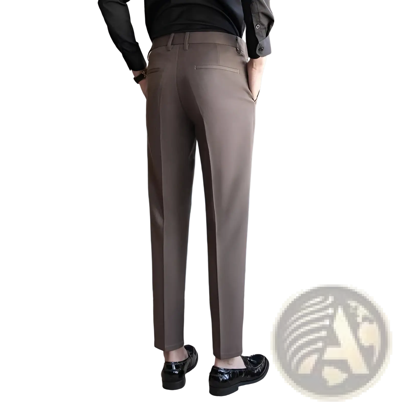 A pair of men’s slim fit British style tailored straight leg brown trousers with subtle stitching details and a modern cut