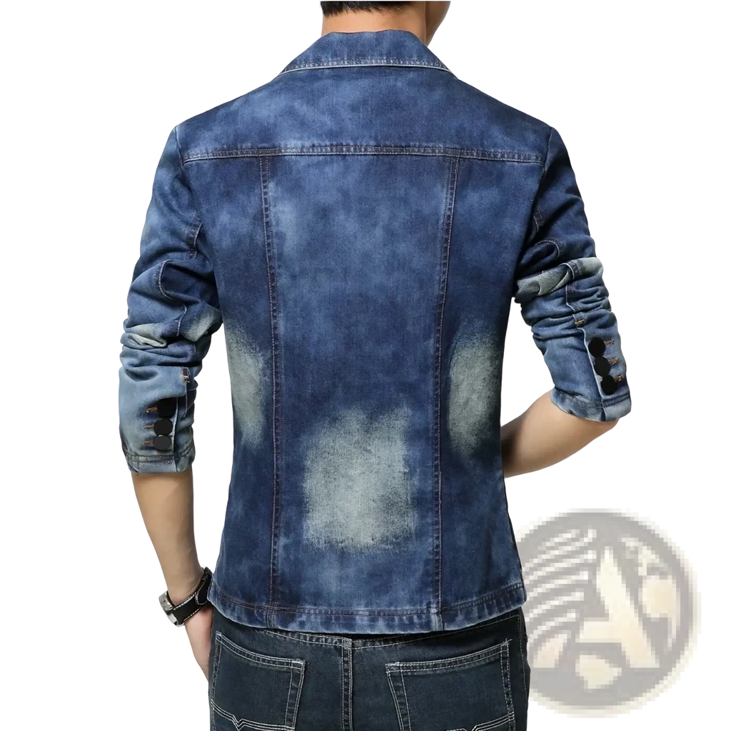 Men’s slim fit denim blazer jacket in medium-wash blue with rolled sleeves and distressed faded patches on the back side