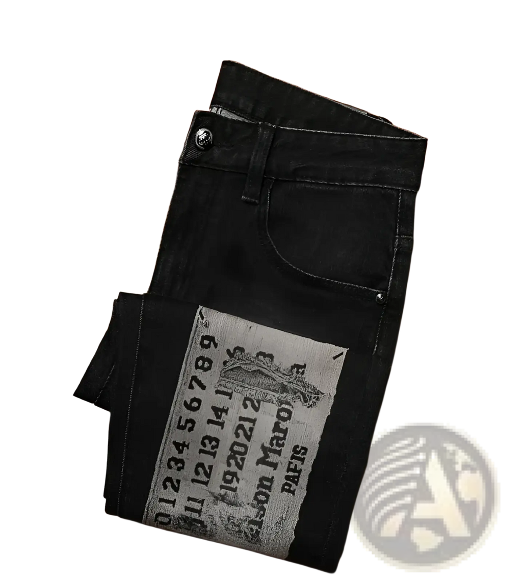 Mens slim fit black denim jeans with gray vintage style patch featuring text and an illustration on the back side