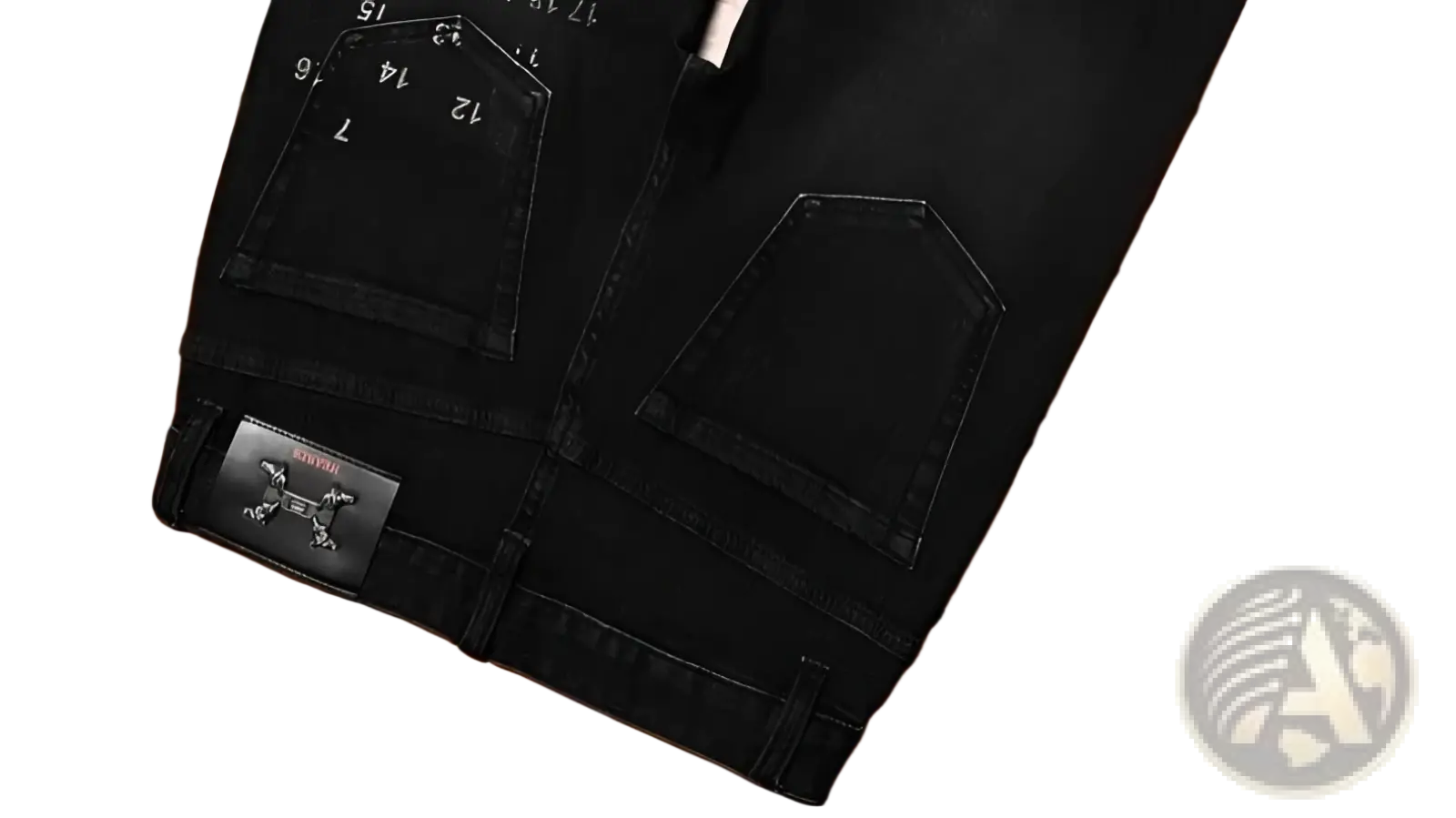 Mens slim fit printed black denim jeans back side with subtle faded texture white numerical markings and branded leather patch