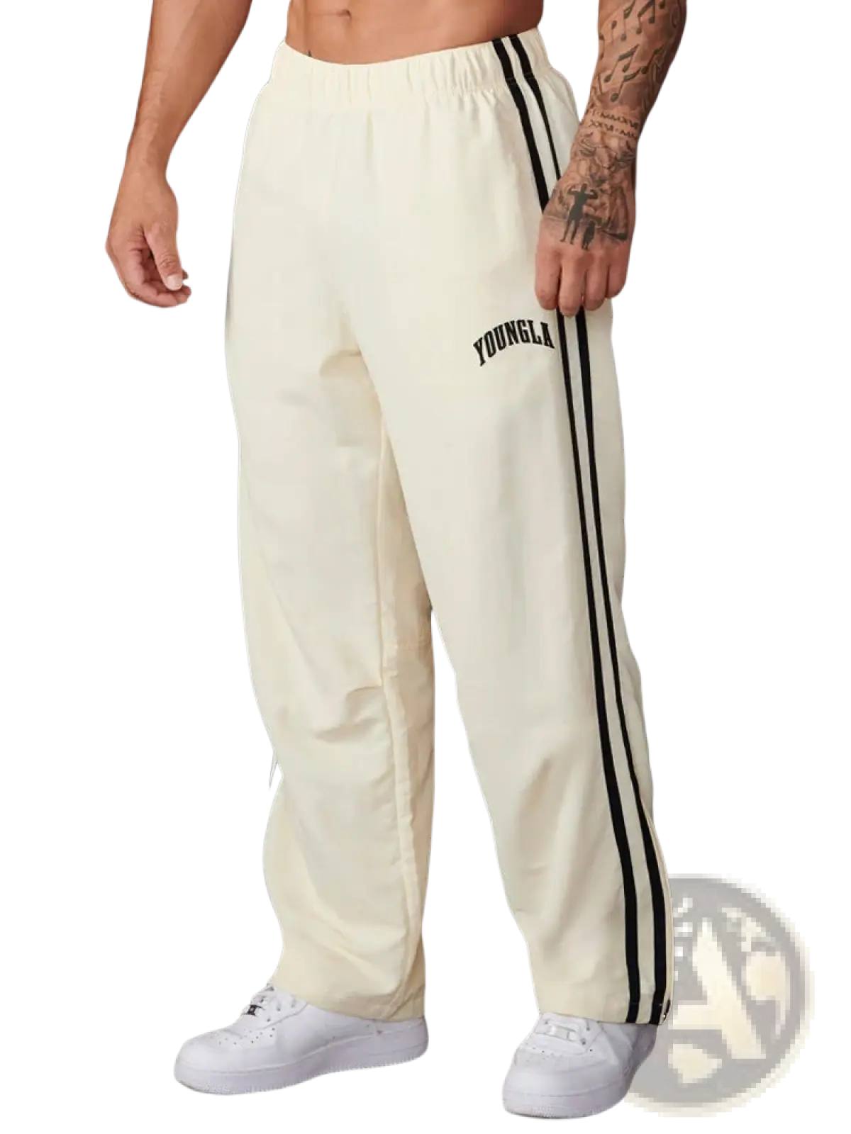 Men’s slim fit athletic track pants in cream color with black side stripes and Youngla logo on the left thigh