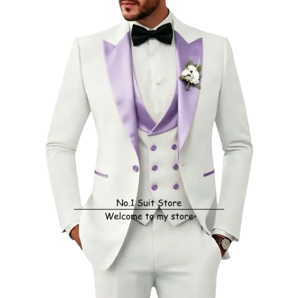Men’s slim fit white tuxedo 3 piece suit with lavender satin lapels, matching buttons, black bow tie, and floral boutonniere