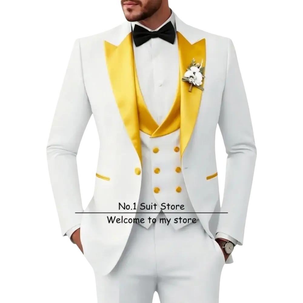 Men’s slim fit white tuxedo 3 piece suit with gold satin lapels, matching buttons, black bow tie, and floral boutonniere