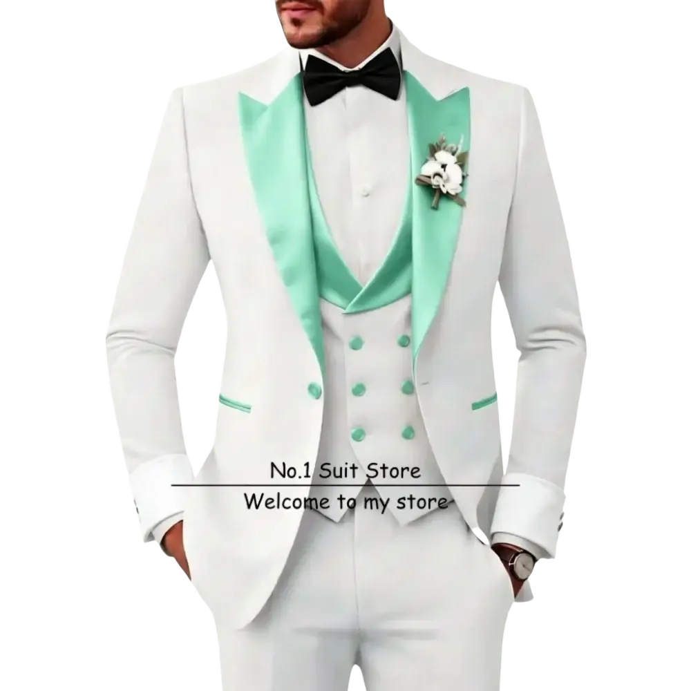 Men’s slim fit white tuxedo 3 piece suit with mint green satin lapels, matching vest, black bow tie, and floral boutonniere