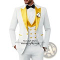 Men’s slim fit white tuxedo 3 piece suit with gold satin lapels, matching buttons, black bow tie, and floral boutonniere