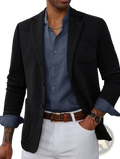 Men’s slim striped suit jacket featuring a black textured blazer with a navy blue shirt underneath for formal wear