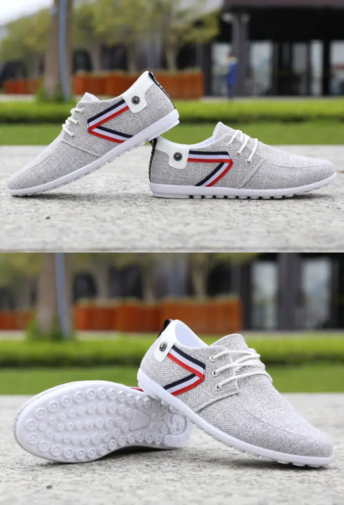 Men’s breathable soft sole gray canvas leisure sneakers with white laces and red blue black striped accent