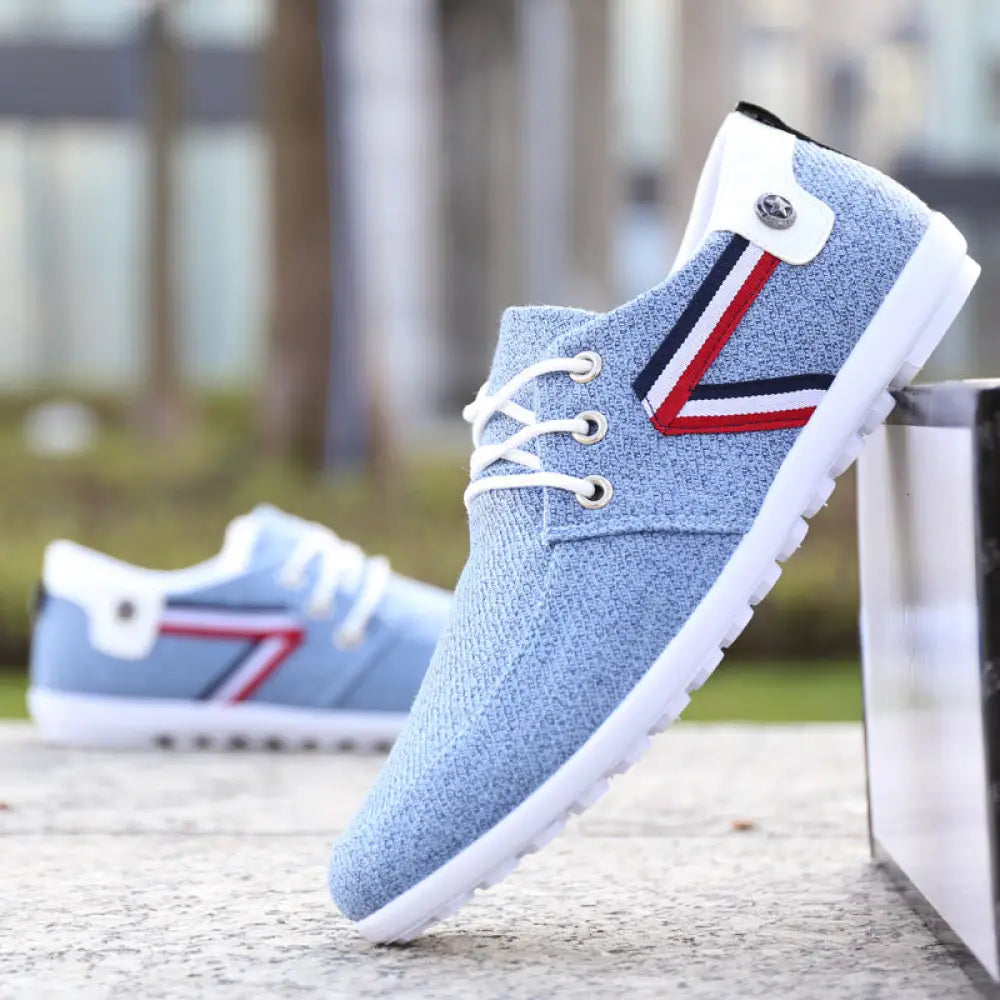 Men’s breathable soft sole light blue canvas leisure sneakers with white laces and red white navy stripe design