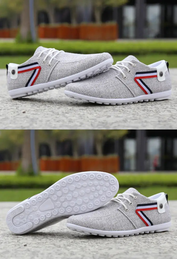 Men’s breathable soft sole gray canvas leisure sneakers with white laces and red blue black striped design on side