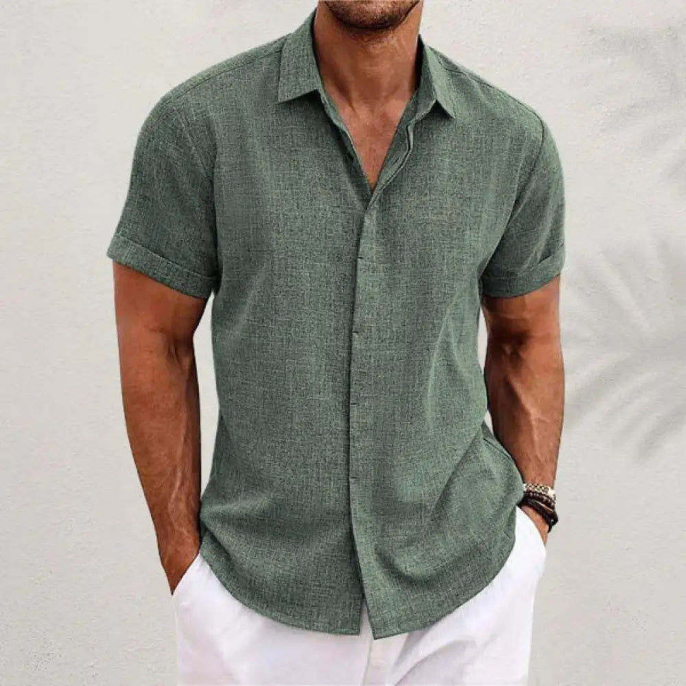Men’s relaxed fit solid linen short sleeve shirt in textured olive green fabric with classic collar and rolled cuffs