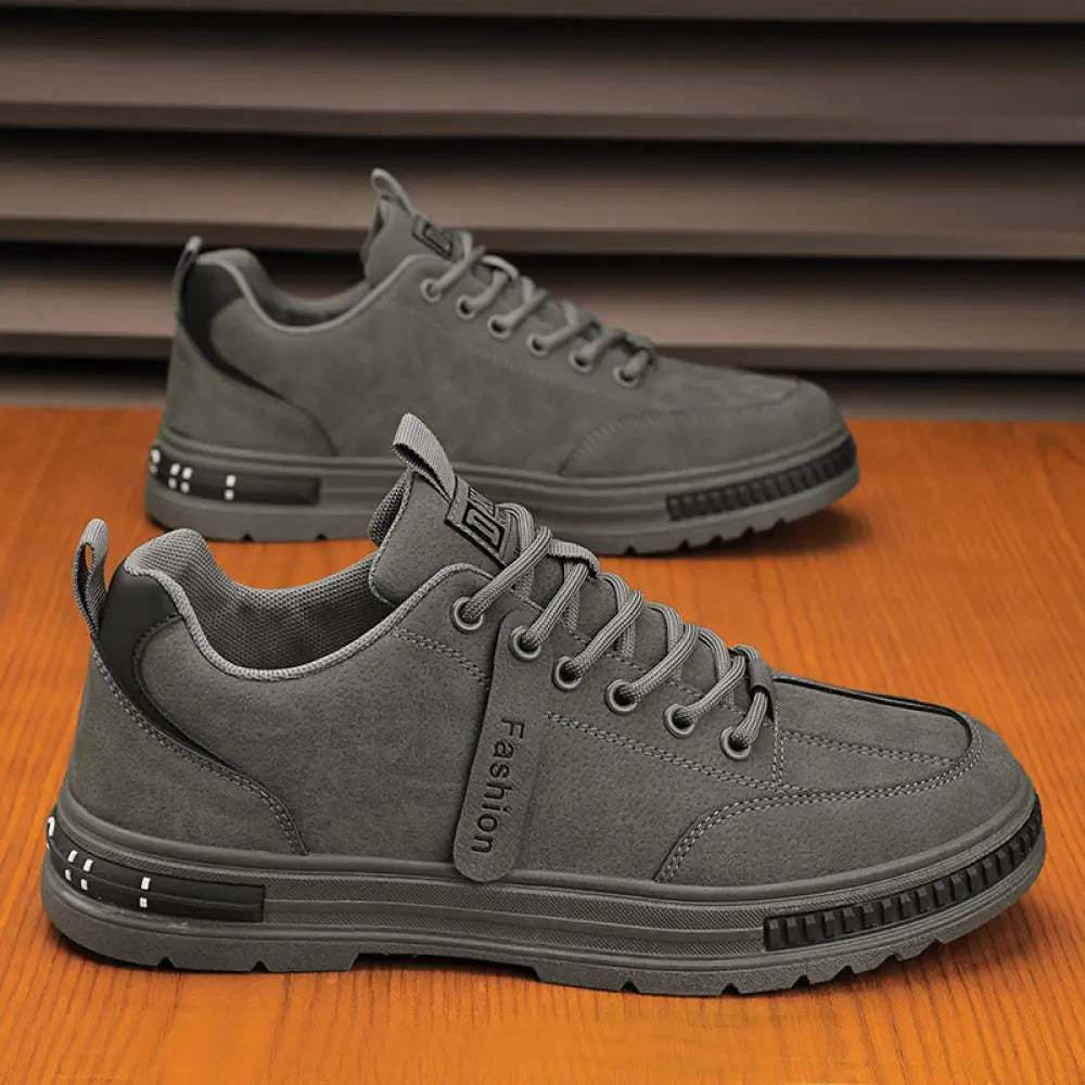 Luxury men’s gray suede rugged platform sneakers with black accents and breathable chunky rubber sole for sport use