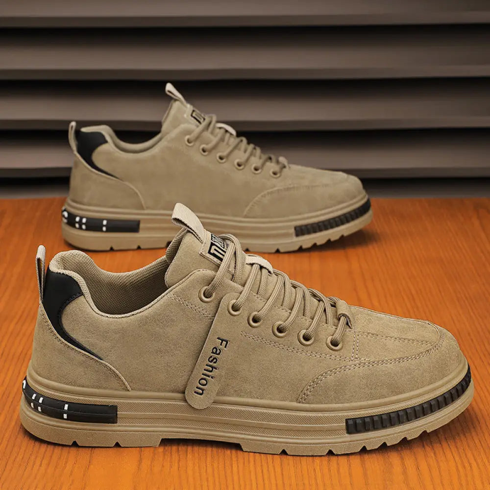 Luxury men’s rugged platform sneakers in beige suede with black accents and fashion branding for breathable sport use