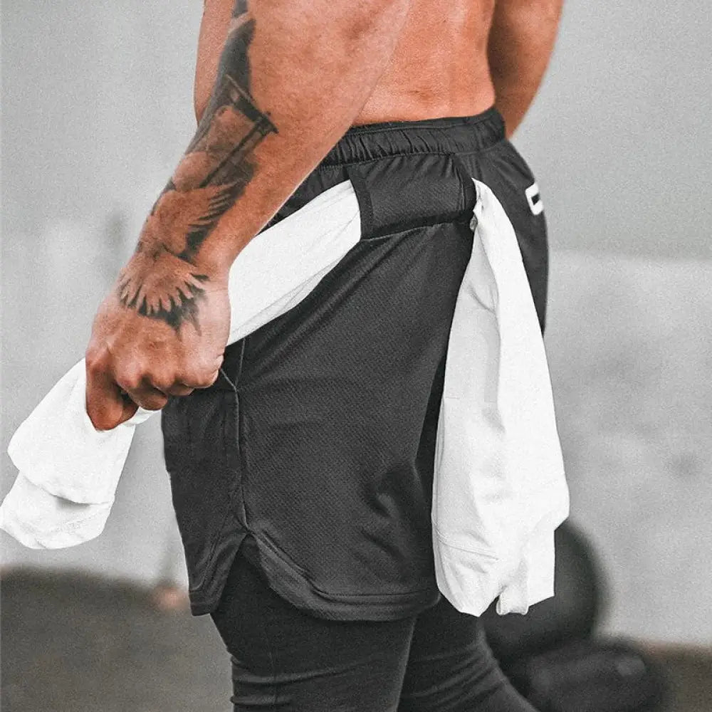 Men’s camouflage quick dry 2-in-1 training shorts in black mesh fabric with white side accents and elastic waistband