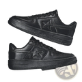 Black leather men’s star emblem sneakers with textured upper and thick rubber sole for casual wear