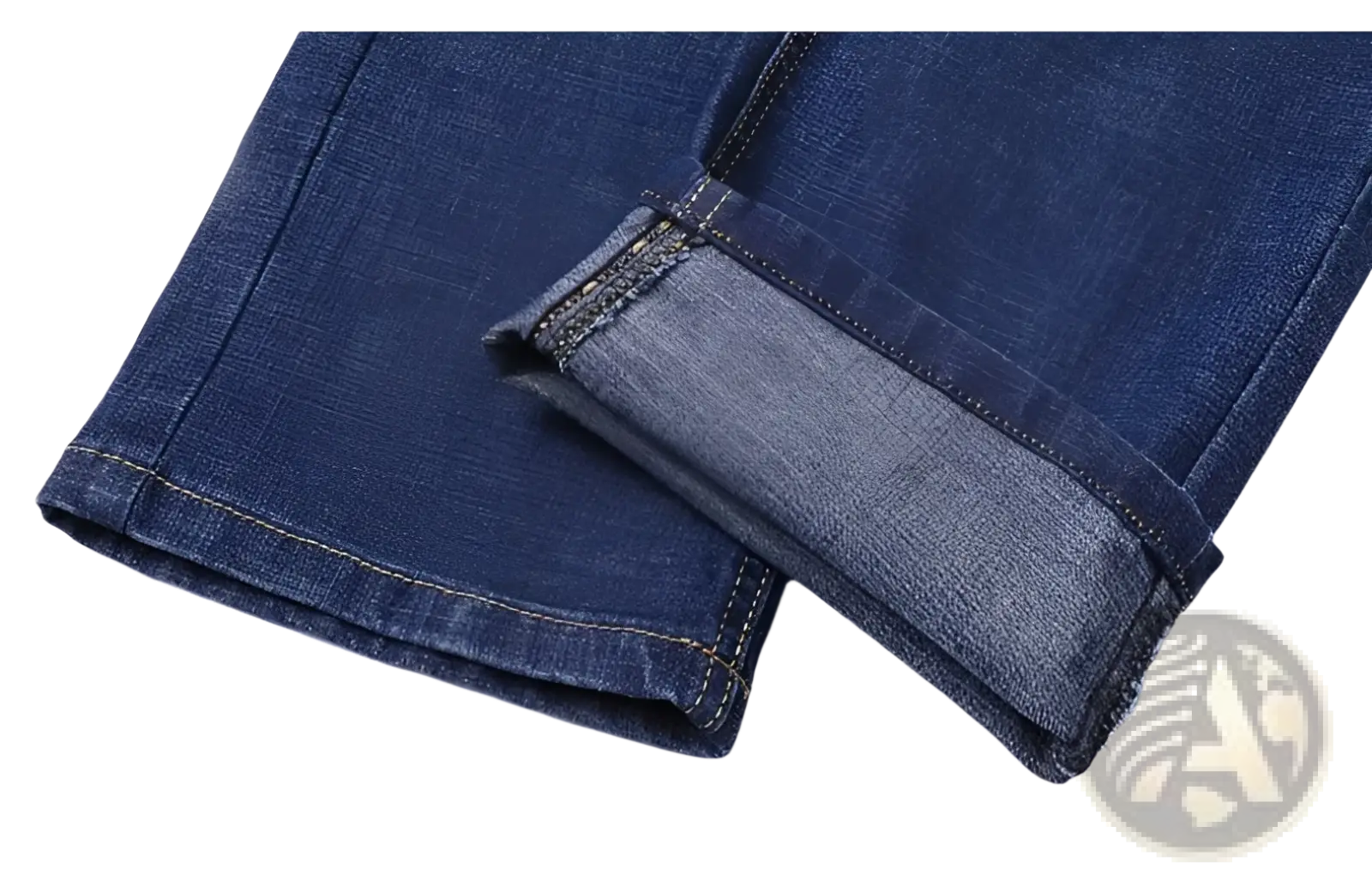 Men’s stretch cotton straight dark blue denim jeans with rolled cuffs revealing lighter inner fabric and contrast stitching