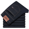 Men’s dark blue stretch cotton straight jeans with white stitching and brown leather brand tag for casual wear