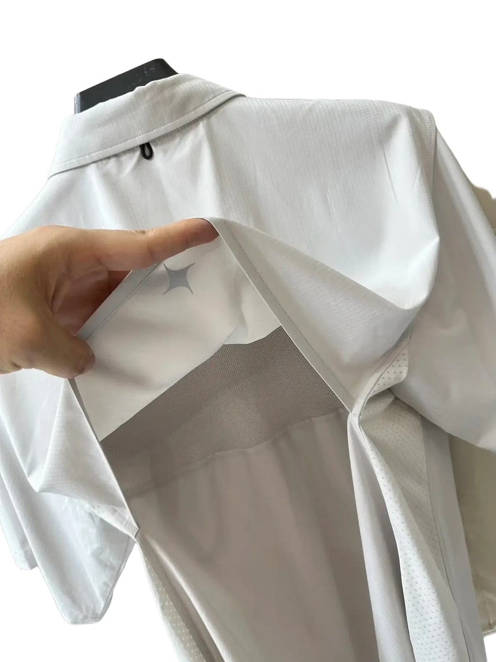 Men’s white stretch outdoor shirt with breathable mesh panels and gray star emblem on the back for quick dry use